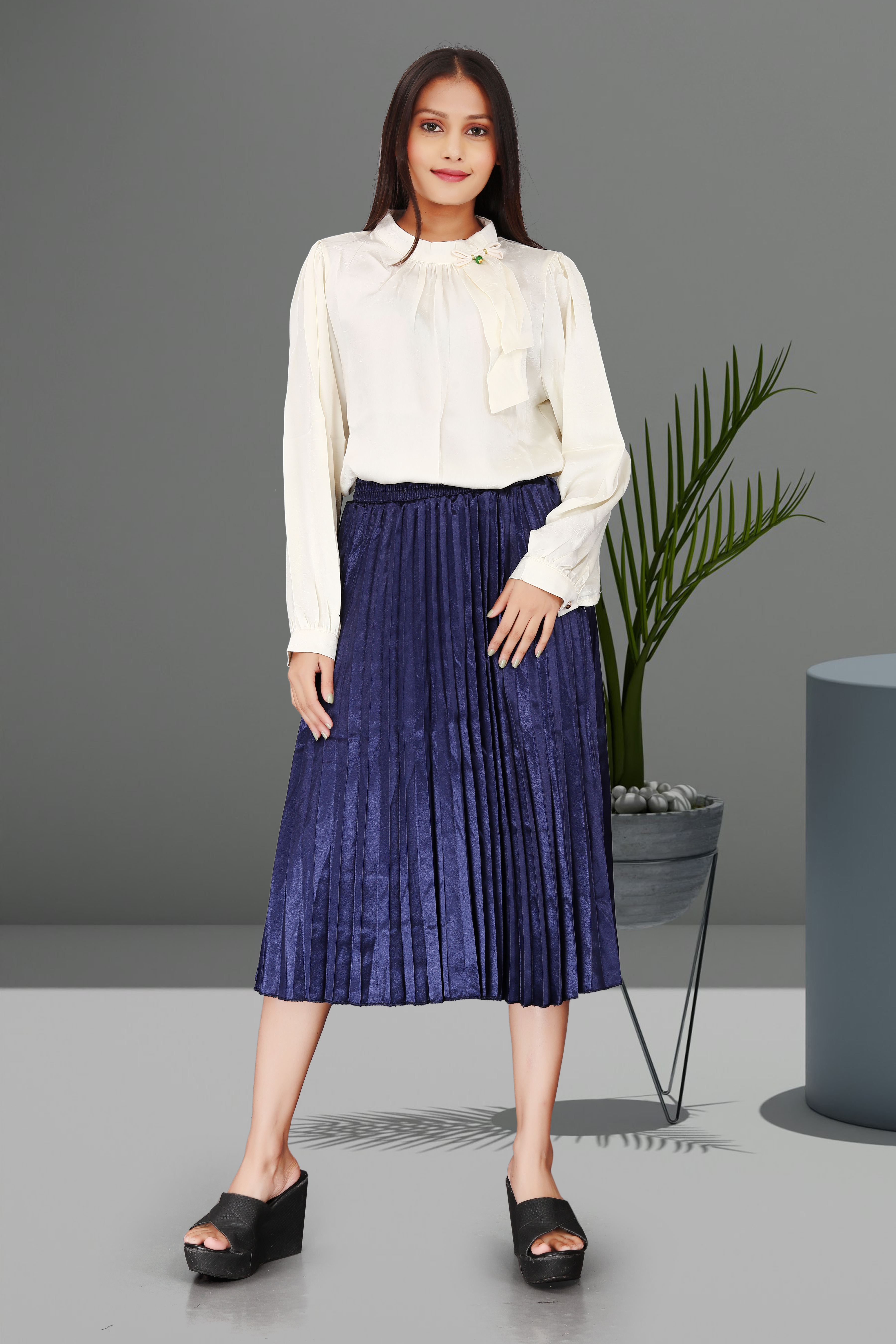 Elegant Ivory Bow Tie Blouse with Navy Blue Pleated Midi Skirt – Sophisticated Workwear & Semi-Formal Outfit